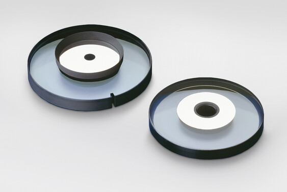 Shaped lenses with metal mirror Shaped lenses with metal mirror